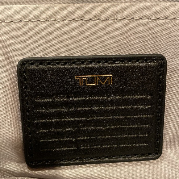 Tumi crossbody bag.
Length is 8.5 inches 
Height is 5.5 inches - Picture 9 of 15